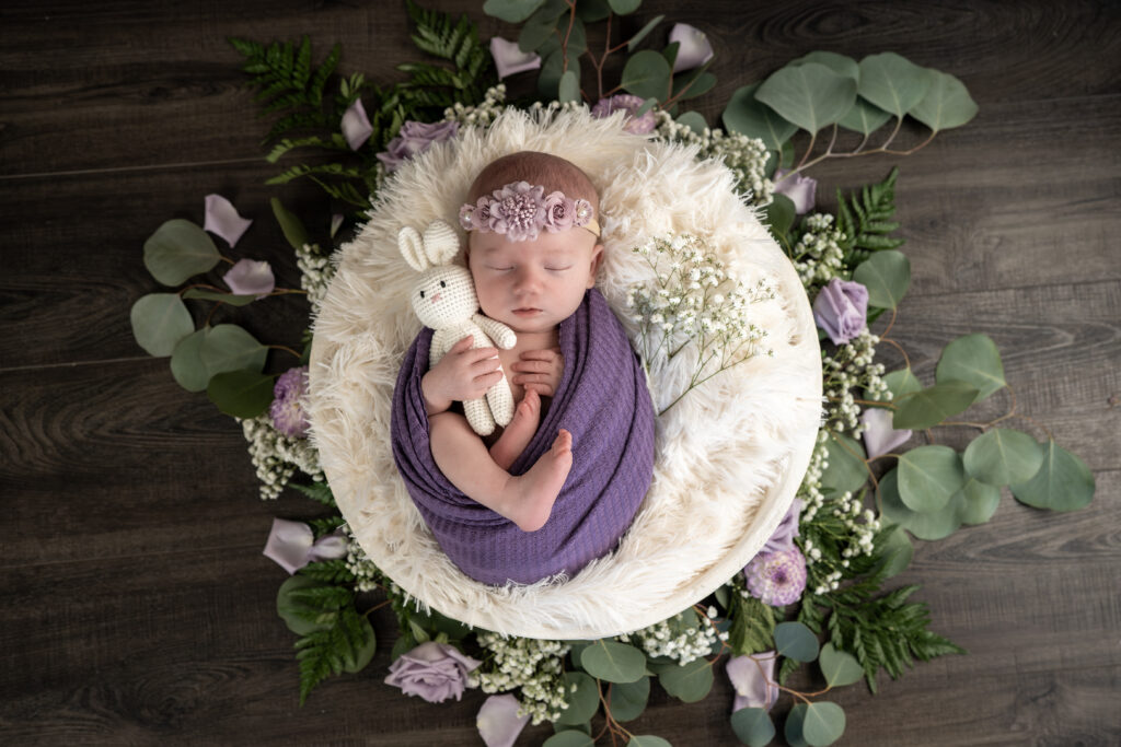 Seattle-area studio newborn session capturing a baby asleep in natural, simple styling designed for printed keepsakes.