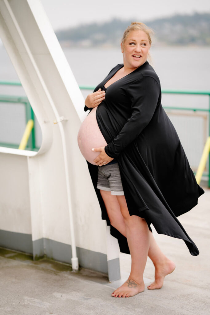 Candid maternity photography on Edmonds ferry overlooking Puget Sound