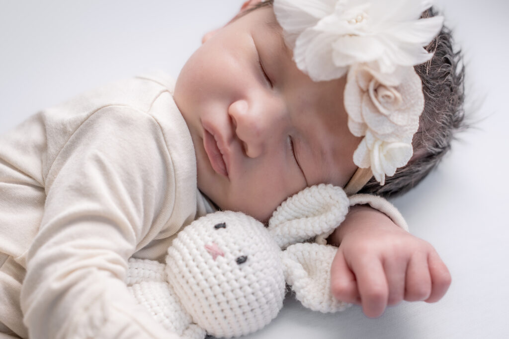 Professional newborn photographer in Seattle documenting a baby’s earliest days with gentle, natural posing.