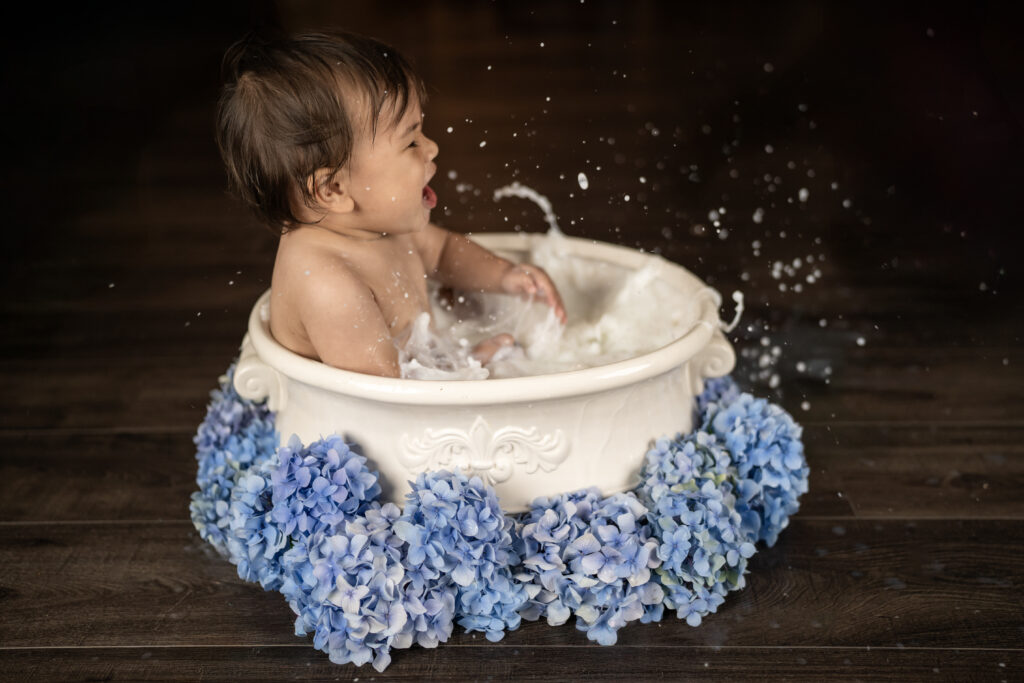 Little ones milk bath photography session to celebrate his first birthday.